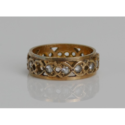 72 - A 9ct Gold and CZ Eternity Ring, c. 5.8mm wide, size K.2t, hallmarked, 3.4g