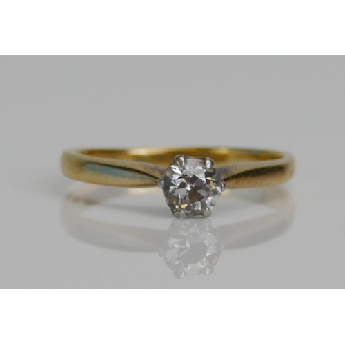 74 - A Brilliant Round Cut Diamond Solitaire Ring in a high carat precious yellow and white metal setting... 