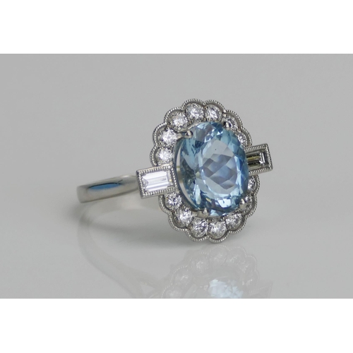 77 - A Platinum, Aqua Marine and Diamond Cluster Ring, c. 12x10.6mm principal stone, surrounded by 14 c. ... 