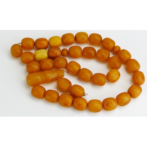 86 - A Large Yellow Amber Rosary Bead, 203.52g