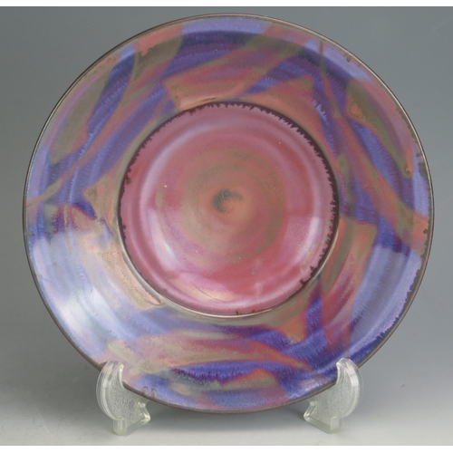 1017 - An Alan Julian Belmont? Studio Pottery Bowl with purple lustre glaze, 23.5cm diam., underglaze paint... 