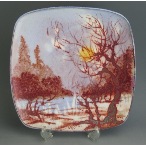 1033 - An Alan Caiger Smith (1930-2020) Studio Pottery Shall Dish decorated with a wooded landscape, 32cm