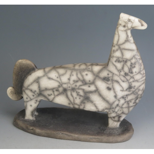 1042 - A Studio Pottery Raku Stylised Model of a Horse, 29cm long, incised CV