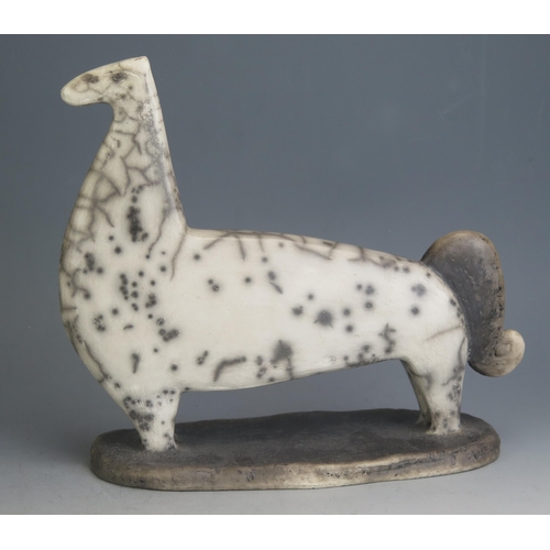 1042 - A Studio Pottery Raku Stylised Model of a Horse, 29cm long, incised CV