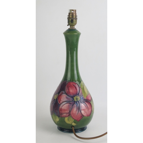 1071 - A Moorcroft pottery table lamp with Clematis pattern decoration, overall height 41cm high.