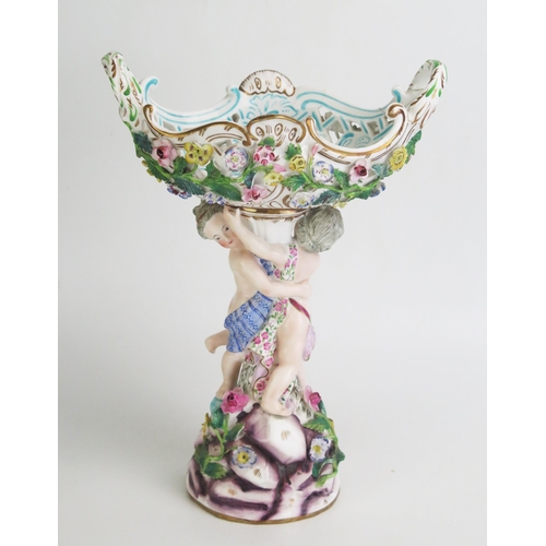 1093 - A continental porcelain pedestal basket, of boat-shaped outline with encrusted floral decoration, su... 