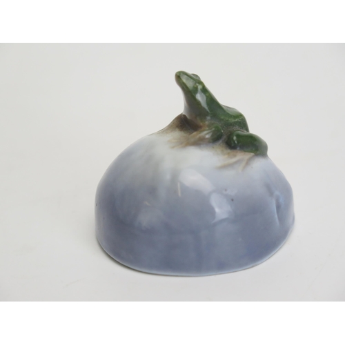 1100A - A Royal Copenhagen porcelain model of a frog seated on a rock 4cm high