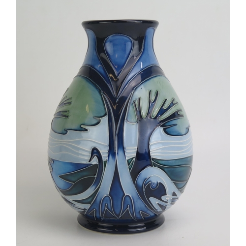 1105 - A Moorcroft pottery vase of ovoid form decorated in the Knypersley pattern by Emma Bossons with tube... 