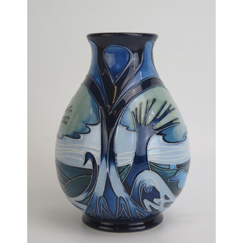 1105 - A Moorcroft pottery vase of ovoid form decorated in the Knypersley pattern by Emma Bossons with tube... 