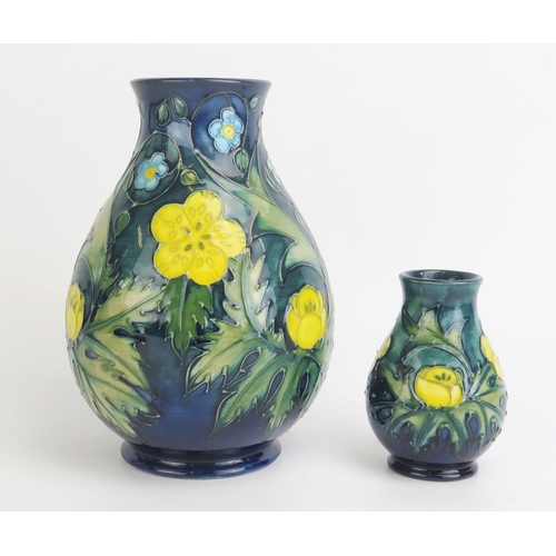 1109 - A Moorcroft pottery vase of ovoid form with Buttercup pattern decoration, 19.5cm high together with ... 