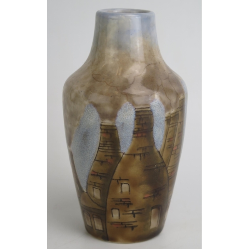 1124 - A Dennis China Works vase decorated with smoking pottery kilns, 16.5cm high.