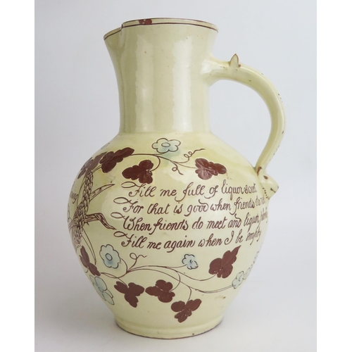 1131 - Edwin Beer Fishley (1836-1912) a Fremington pottery Harvest Jug, decorated in pale yellow slip with ... 