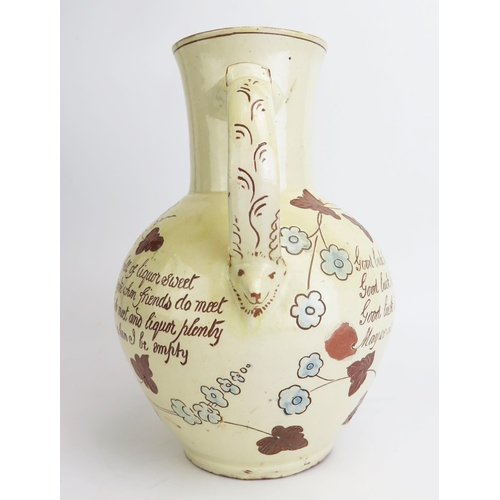 1131 - Edwin Beer Fishley (1836-1912) a Fremington pottery Harvest Jug, decorated in pale yellow slip with ... 