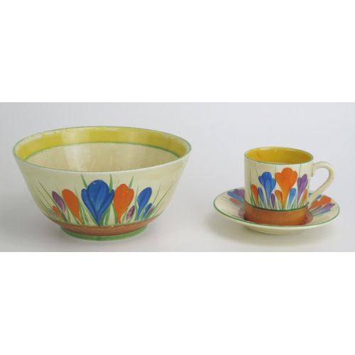 1134 - A Clarice Cliff 'Crocus' pattern coffee can and saucer together with a matching sugar basin.