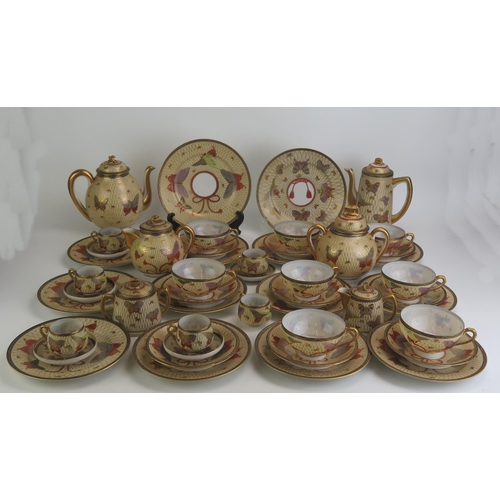 1155 - An extensive Noritake eggshell porcelain tea and coffee service, decorated in the Satsuma style with... 