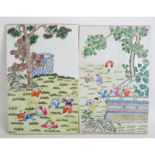 1158 - A pair of Chinese porcelain panels each decorated in enamels with children playing in garden setting... 