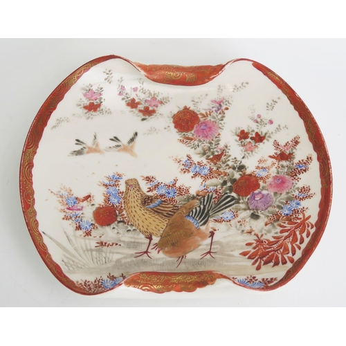 1160 - A Kutani porcelain dish with scrolled border, decorated with exotic birds amongst flowering shrubs, ... 