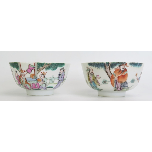 1164 - A pair of Chinese famille verte rice bowls decorated with figures in a garden landscape, 12cm diamet... 