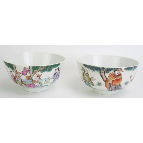 1164 - A pair of Chinese famille verte rice bowls decorated with figures in a garden landscape, 12cm diamet... 