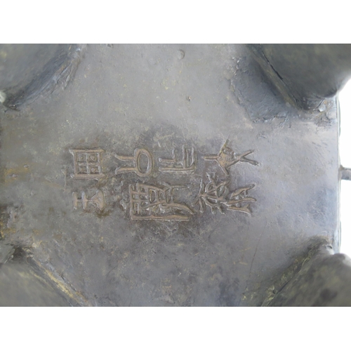 1169 - A Chinese bronze censer and cover, of rectangular outline with archaic designs, having a domed wood ... 