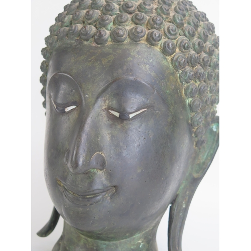 1170 - A large Thai bronze head of Buddha, having mother-of-pearl inset eyes, with traditional flaming head... 