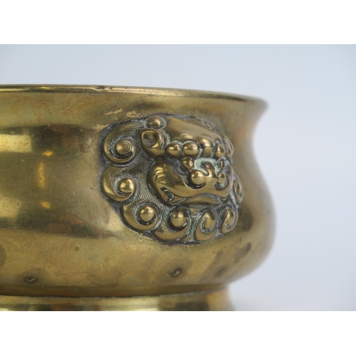 1171 - A Chinese bronze censer, of plain circular form, with dragon mask handles, bears six character Xuand... 