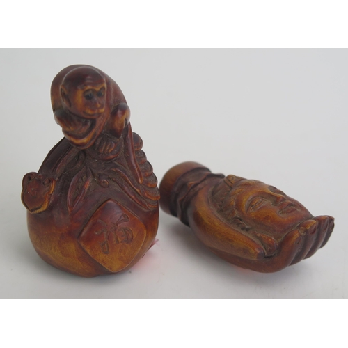 1176 - A carved boxwood netsuke in the form of a monkey seated on gourd, signed, 6.5cm high, together with ... 