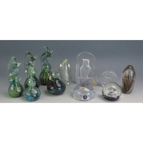 1194 - Four Mdina glass paperweights with horse head terminals, together with other assorted glass paperwei... 