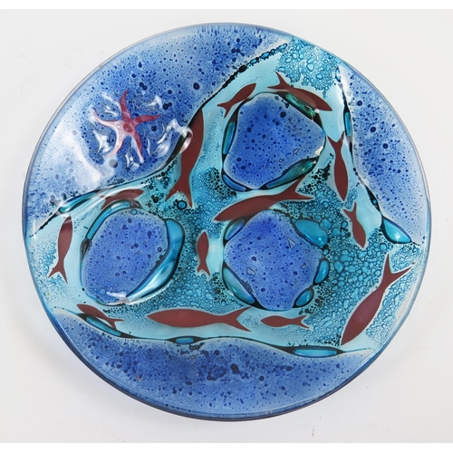 1199A - Jo Downs, an art glass dish decorated with fish and starfish, 20cm diameter