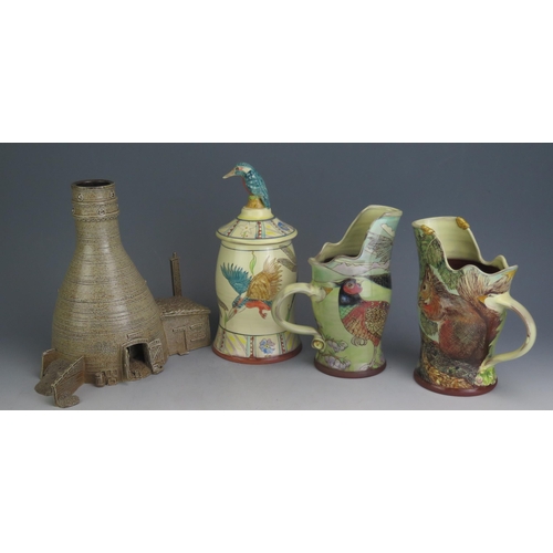 1206 - A Near Pair of Studio Pottery Terracotta Jugs, one decorated with a red squirrel and green woodpecke... 