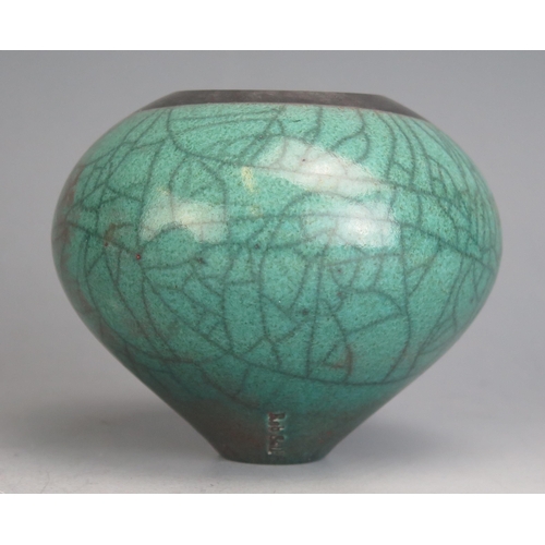 1220 - Rob Sollis (b. 1966) _ A  Studio Pottery Raku Vase, 9cm high, impressed mark