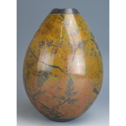 1229 - Andrew Hill _ A Studio Pottery Raku Vase with foliate decoration, 22cm high, incised initials