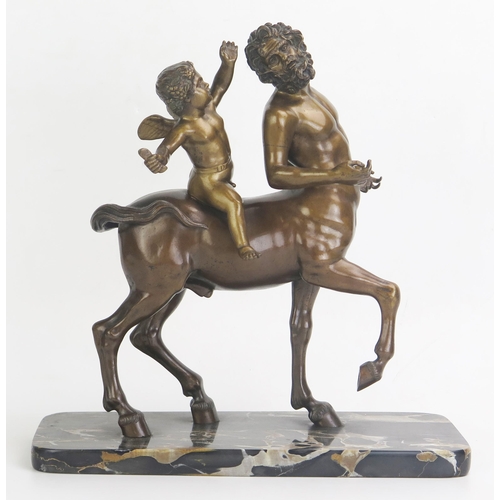 1245 - A bronze study of Chiron Centaur being teased by Eros, mounted on a rectangular polished marble base... 