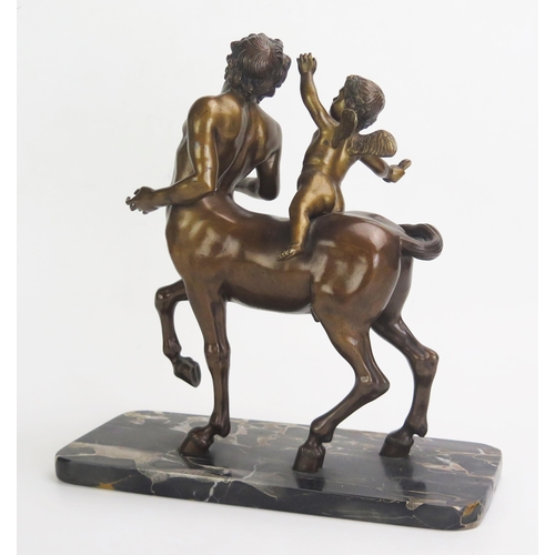 1245 - A bronze study of Chiron Centaur being teased by Eros, mounted on a rectangular polished marble base... 