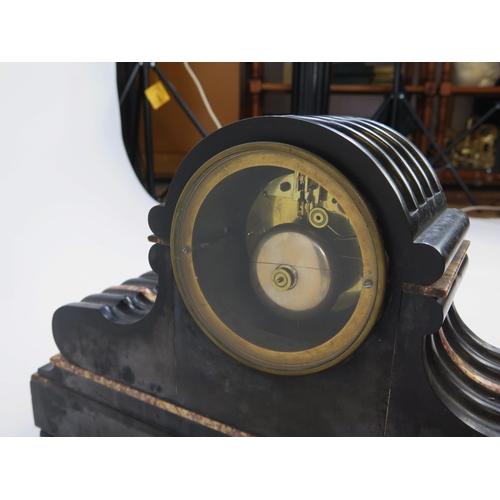 1248 - A late Victorian polished slate and marble mantel clock, of arched outline the drum shaped case  wit... 