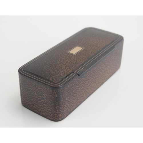 1262 - A 19th century blonde tortoiseshell snuff box of rectangular outline with veneer to the exterior, wi... 