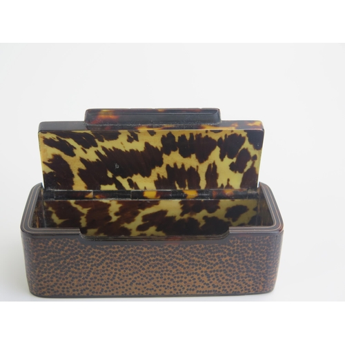 1262 - A 19th century blonde tortoiseshell snuff box of rectangular outline with veneer to the exterior, wi... 