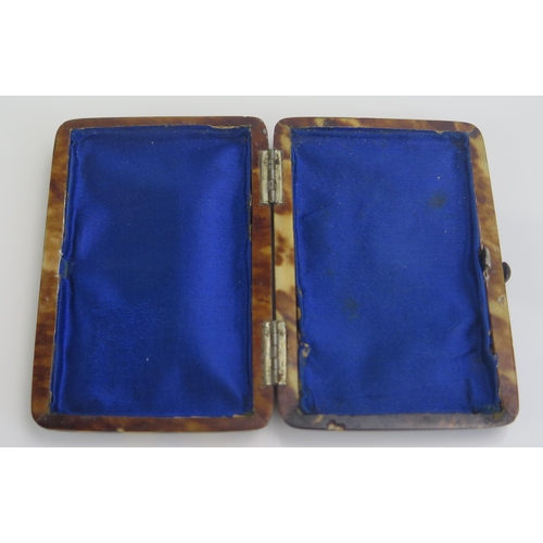 1264 - A tortoiseshell and silver mounted box, of rectangular form, with blue silk lined interior, 9cm wide... 