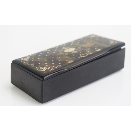 1265 - A faux tortoiseshell and gold inlaid snuff box, of rectangular outline, 9cm long, (chipped to side),