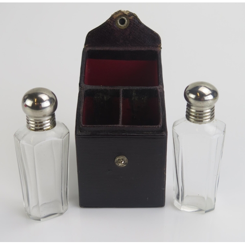 1269 - A pair of clear glass scent bottles, contained in a Morocco leather travelling case. each bottle 7.5... 