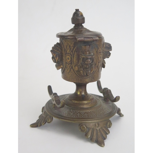 1270 - A late 19th century bronze pen and ink stand and cover, the hinged lid with acorn finial, the bowl d... 