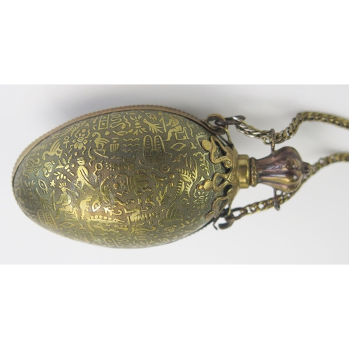 1274 - A late Victorian brass  egg shaped chatelaine scent bottle and stopper decorated with Egyptianesque ... 