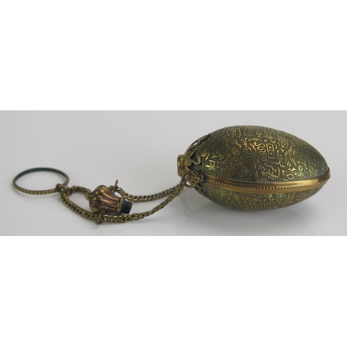 1274 - A late Victorian brass  egg shaped chatelaine scent bottle and stopper decorated with Egyptianesque ... 