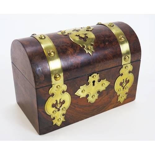 1279 - A Victorian walnut and brass mounted stationery casket, with domed hinged lid enclosing a fitted int... 