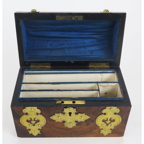 1279 - A Victorian walnut and brass mounted stationery casket, with domed hinged lid enclosing a fitted int... 