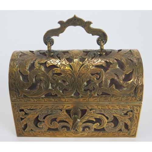 1282 - A brass mounted trinket casket, of rectangular outline, the domed hinged lid enclosing a velvet line... 