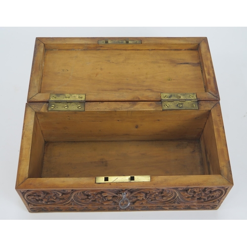 1290 - A 20th century Indian carved hardwood box, of rectangular outline, the hinged lid decorated with dan... 