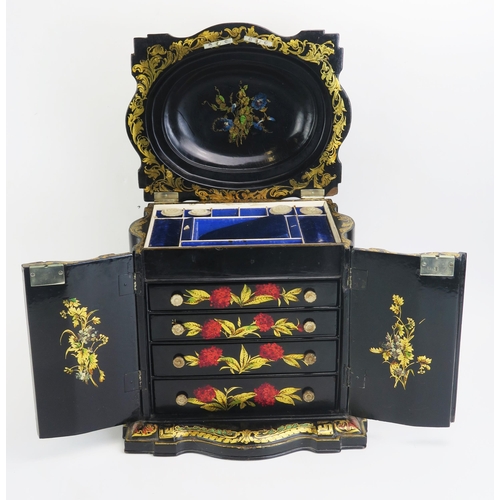 1298 - A Victorian papier-mache work box, of serpentine outline, with shallow domed hinged lid above a pair... 