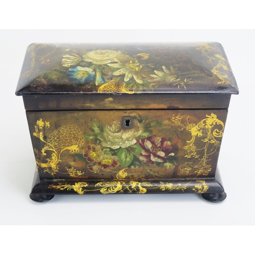 1300 - A 19th century papier mache tea caddy, of rectangular outline, the hinged lid enclosing two lidded z... 