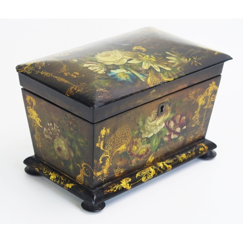 1300 - A 19th century papier mache tea caddy, of rectangular outline, the hinged lid enclosing two lidded z... 